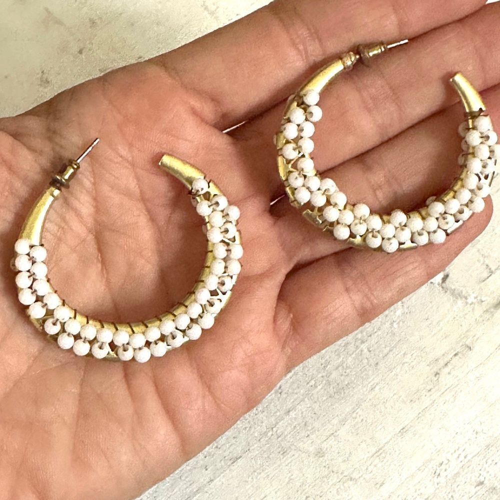Gold tone white beaded hoop earrings